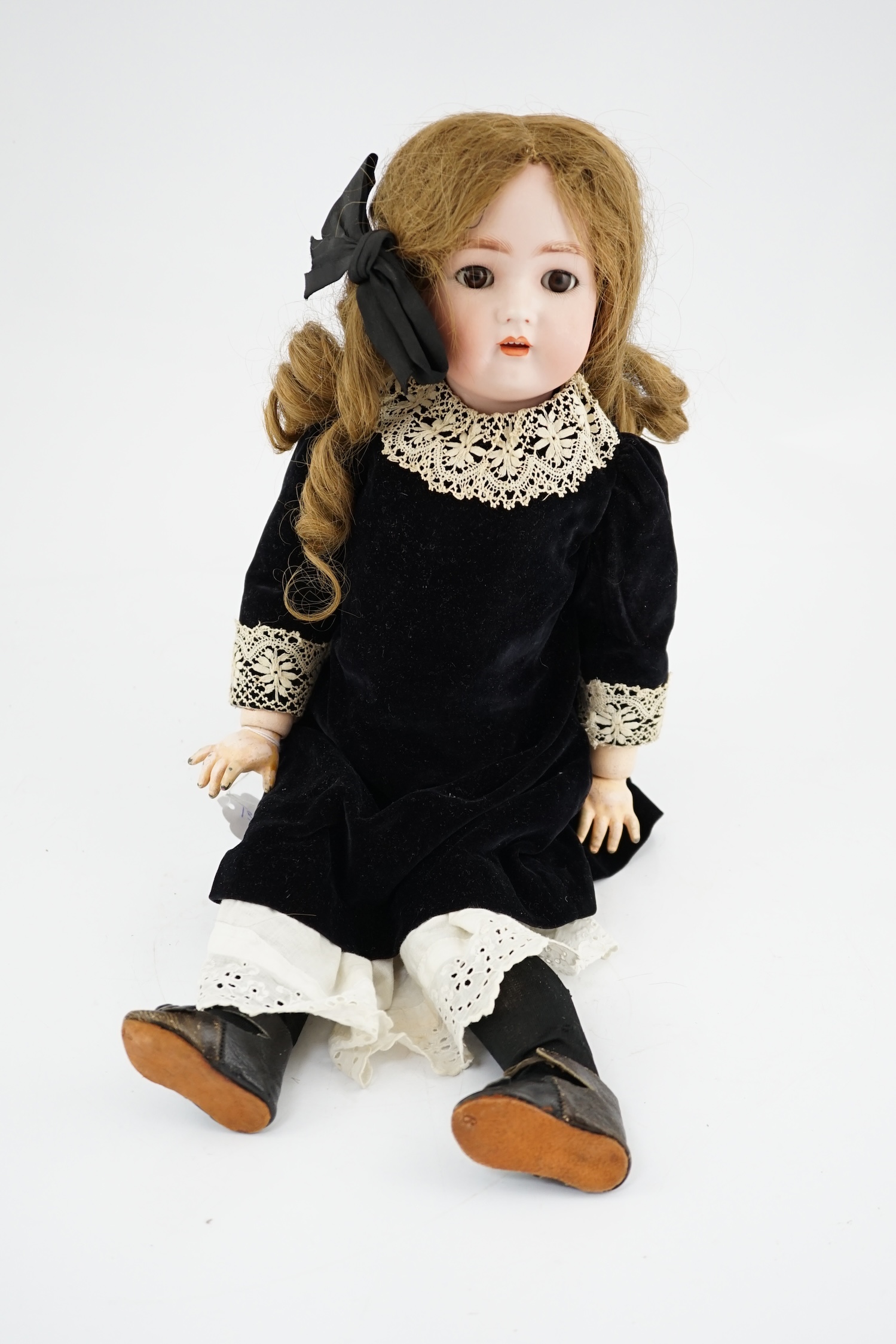 A Kramer & Reinhard/S&H bisque head doll, pierced ears, original wig, clothes and shoes, 52cm